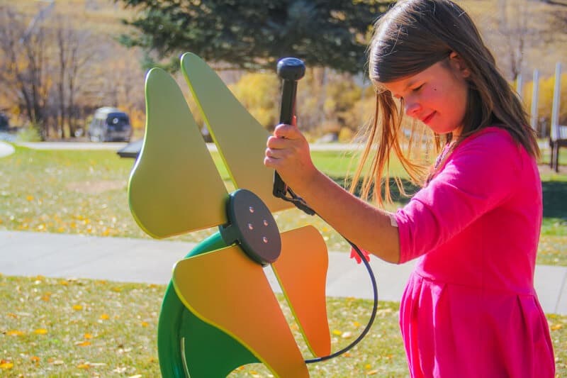 playground metal flowers and a girl