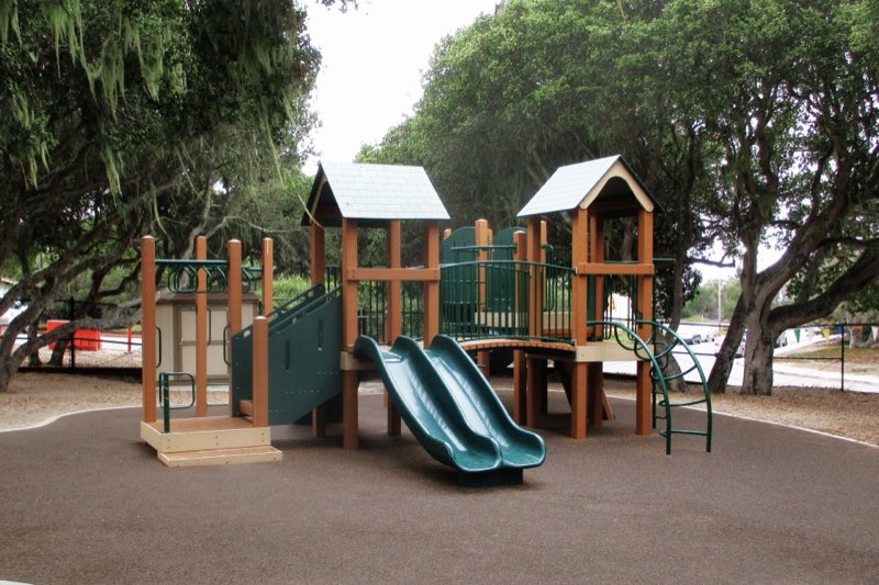 Installed play structure under mature trees