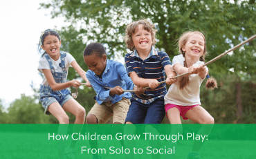 Children playing tug of war outdoors, pulling a rope together, showing teamwork and social play.