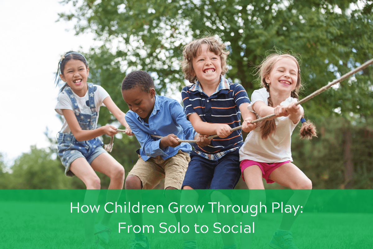 Children playing tug of war outdoors, pulling a rope together, showing teamwork and social play.